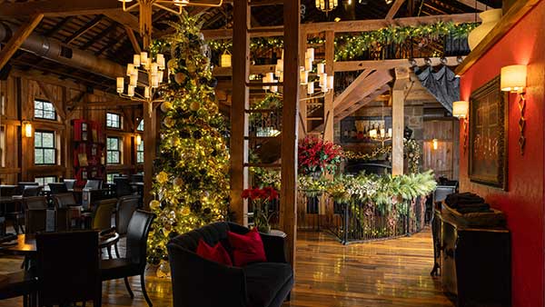 Holiday-decorated interior of The Bistro at Gervasi Vineyard with Christmas tree and festive garlands