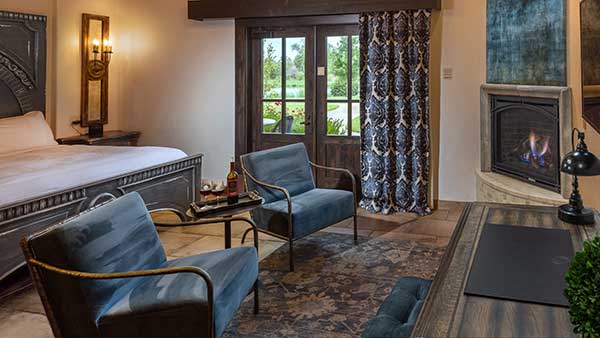 Elegant Casa Suite at Gervasi Vineyard with fireplace, luxury furnishings, and vineyard views