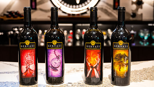 Gervasi Vineyard Family Reserve red wines displayed in a row on the tasting bar, highlighting premium estate varietals available during spring and summer.