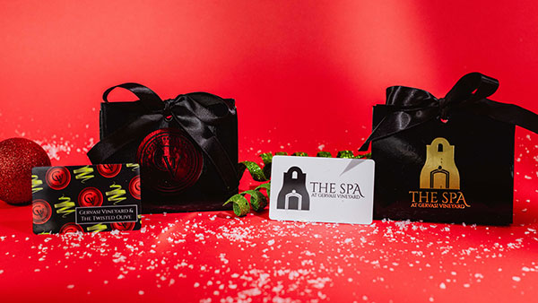Gervasi Vineyard and The Spa at Gervasi Vineyard gift cards elegantly presented with black and red holiday packaging, ideal for Christmas gifting.