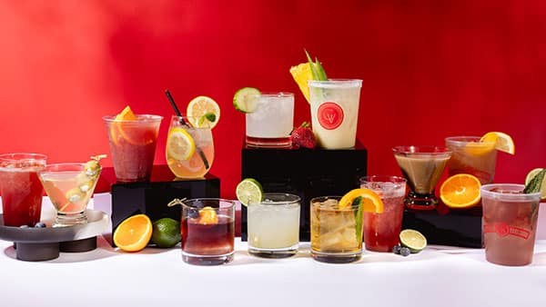 Assorted summer cocktails from Gervasi Vineyard featuring fresh garnishes, citrus fruits, and vibrant seasonal flavors