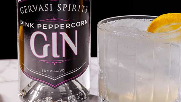 Refreshing pink gin cocktails with citrus garnish made with Gervasi Spirits Pink Peppercorn Gin
