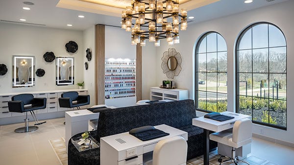 Elegant interior view of The Spa at Gervasi Vineyard’s salon and nail area, featuring modern decor, natural light, and luxurious treatment stations.