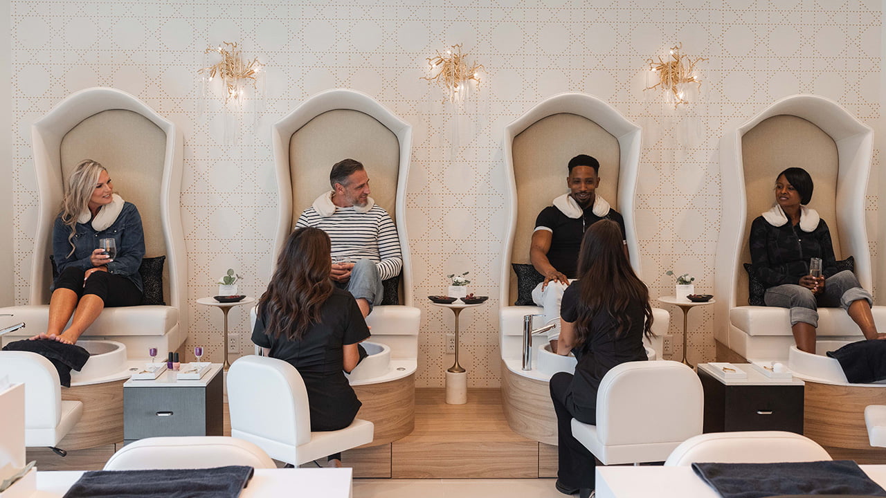 Guests enjoy side-by-side pedicure treatments in the modern nail salon at The Spa at Gervasi Vineyard in Canton, Ohio, a destination for group spa outings and summer self-care.
