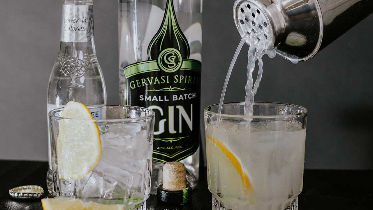 Small batch gin from Gervasi Spirits poured into a cocktail glass with lemon garnish, shown with tonic and ice for a crisp summer cocktail in Canton, Ohio.