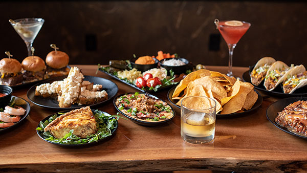 Assorted craft cocktails and small plates at Gervasi Vineyard’s Still House, including tacos, sliders, dips, and artisan entrees.
