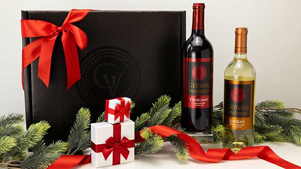 Gervasi Vineyard holiday wine gift box featuring Truscano and Lucello wines with red ribbon and seasonal decorations